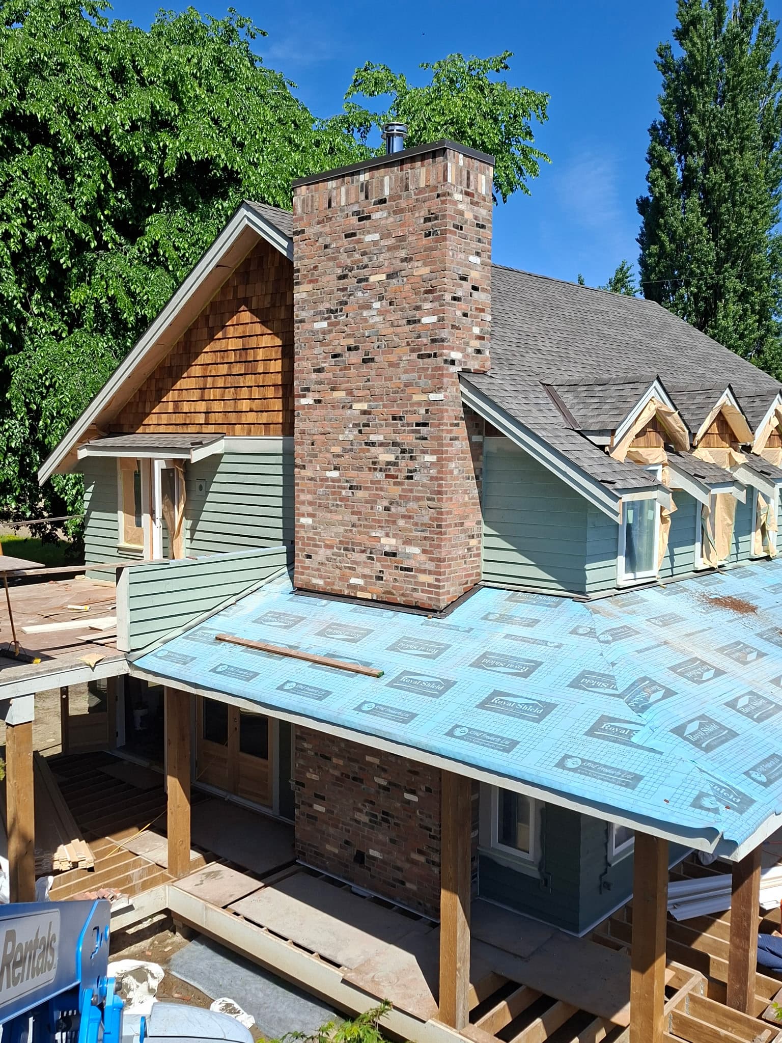 Tall brick chimney and brickwork on a custom home exterior