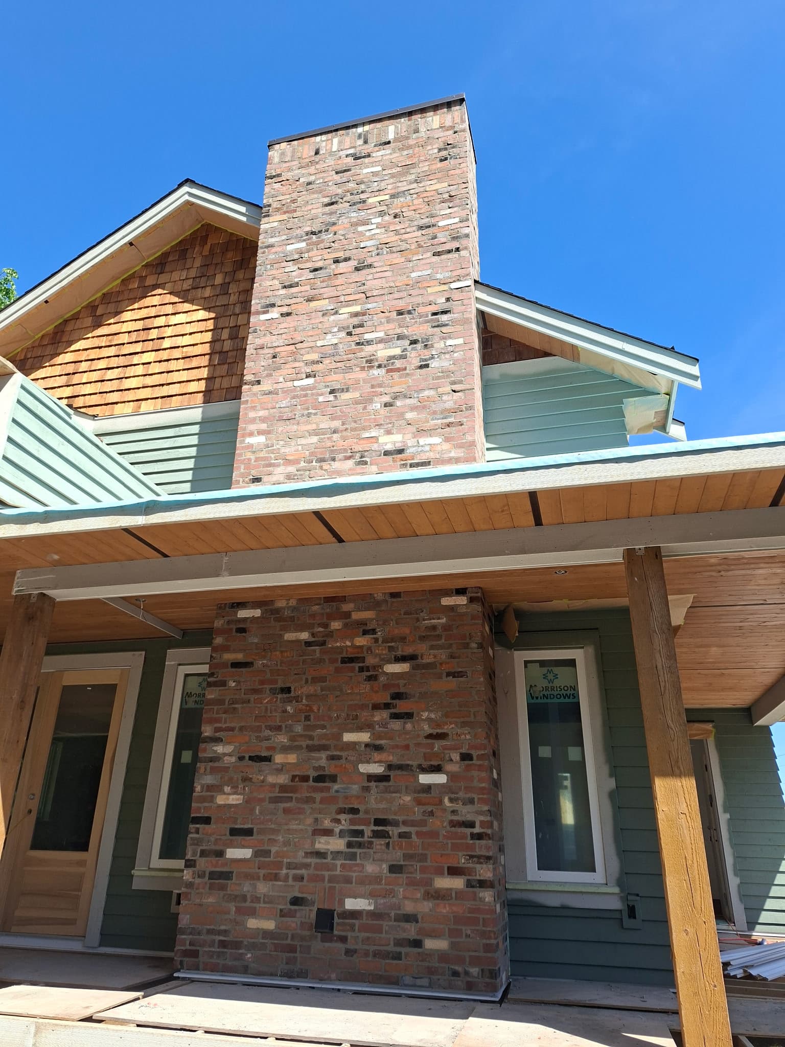 Brick chimney and brick porch column on a custom home